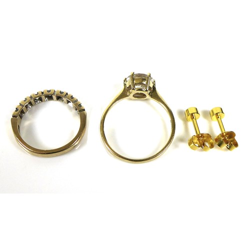 253 - Two gold and white stone rings, comprising a 14ct gold ring set with a large white stone, size P/Q, ... 