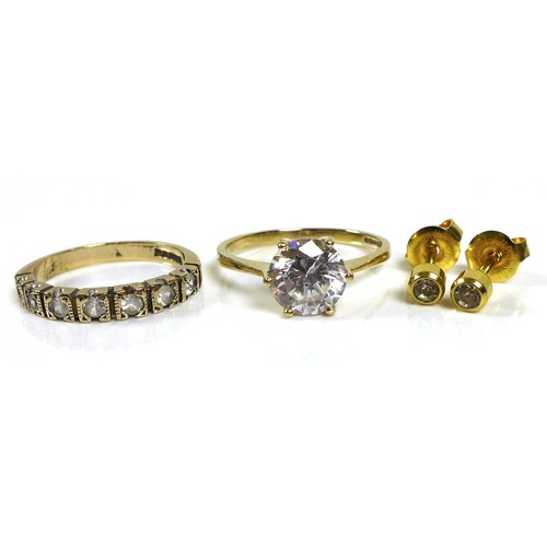 253 - Two gold and white stone rings, comprising a 14ct gold ring set with a large white stone, size P/Q, ... 