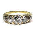An 18ct yellow gold and diamond five stone ring, the old brilliant cut stones graduating in size, ce... 