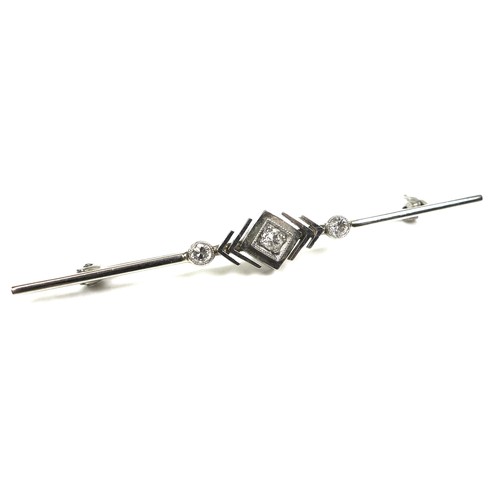 252 - An Art Deco 18ct white gold and platinum bar brooch, set centrally with a 2mm round cut diamond, in ... 