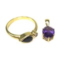 A 18ct gold, sapphire and diamond ring of unusual design, formed of a pear cut sapphire, of dark col... 