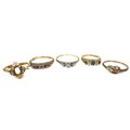 A group of five gold rings, comprising an 18ct gold bi-colour solitaire ring with a brilliant cut di... 