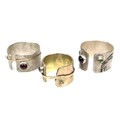 A group of three modern design rings by Bek Genery, all of open design, one gold, unmarked and untes... 