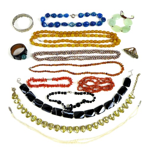 260 - A group of costume jewellery, including a long amber necklace, a cultured pearl double strand neckla... 