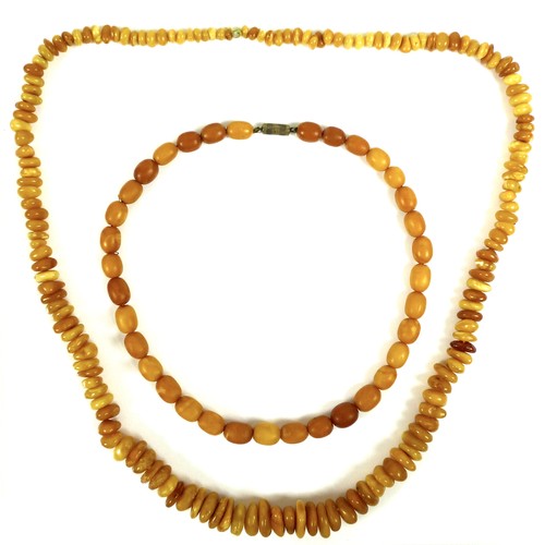 261 - Two amber necklaces, one formed of unpolished graduated butterscotch beads of irregular shape, large... 