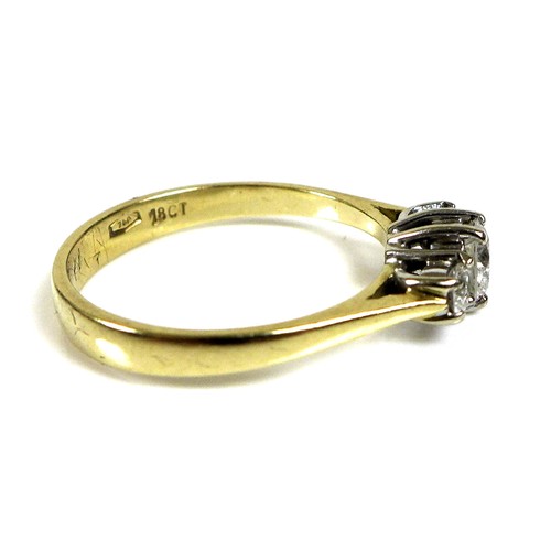 368 - An 18ct gold and diamond three stone ring, the central stone of approximately 4.3mm diameter and 0.2... 