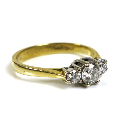 368 - An 18ct gold and diamond three stone ring, the central stone of approximately 4.3mm diameter and 0.2... 