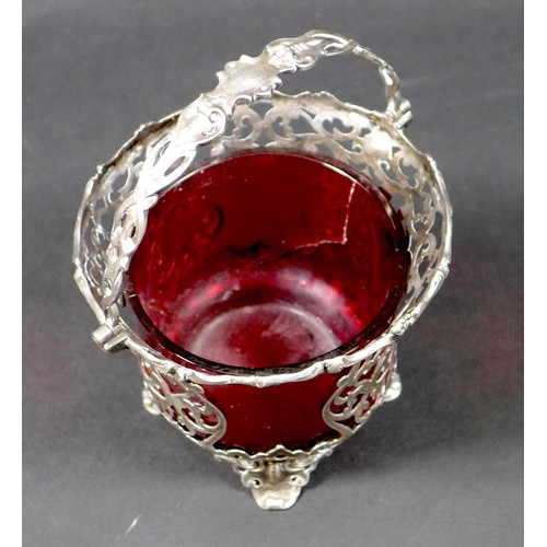 9 - A Victorian silver swing handle basket, with pierced scrolling body, George John Richards, London 18... 