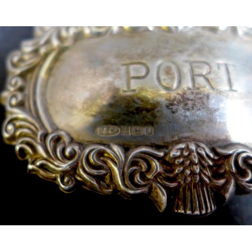 15 - A group of silver items, comprising, 'Port' decanter label, 4.3 by 6.7cm, capstan inkwell, pair of w... 