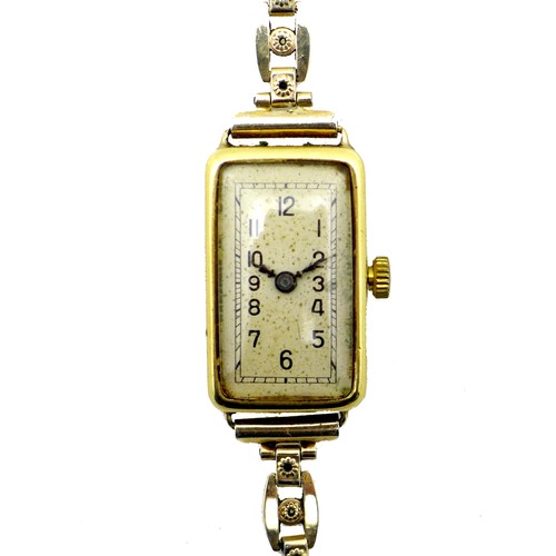 258 - An 18ct gold cased lady's cocktail watch, circa 1930, the rectangular silvered dial with black Arabi... 