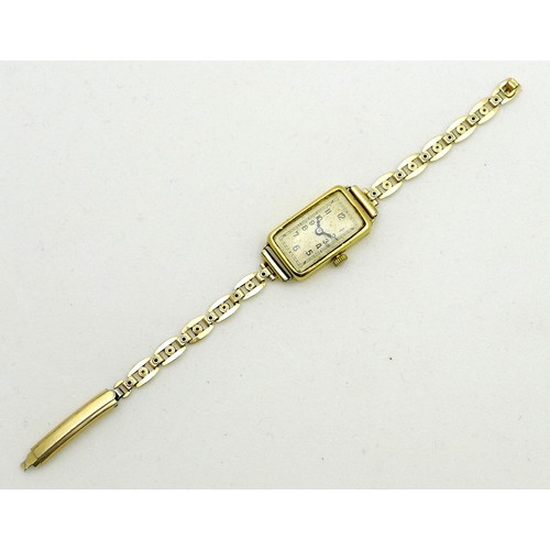 258 - An 18ct gold cased lady's cocktail watch, circa 1930, the rectangular silvered dial with black Arabi... 