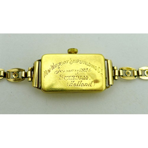 258 - An 18ct gold cased lady's cocktail watch, circa 1930, the rectangular silvered dial with black Arabi... 