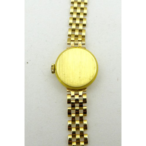 85 - A vintage Tissot 9ct gold cased lady's wristwatch, ref. 1061, circular brushed silver dial with blac... 