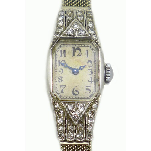 89 - An Art Deco Longines platinum and diamond set lady's cocktail watch, the tank shaped case set with t... 