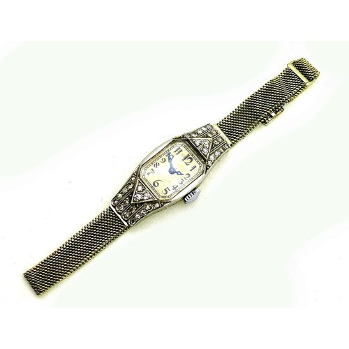 89 - An Art Deco Longines platinum and diamond set lady's cocktail watch, the tank shaped case set with t... 