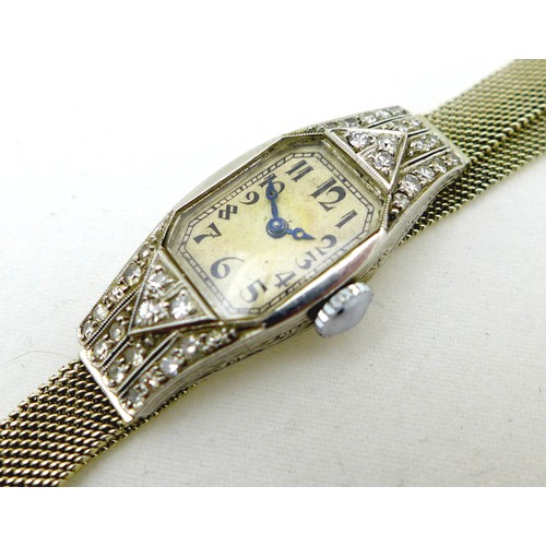 89 - An Art Deco Longines platinum and diamond set lady's cocktail watch, the tank shaped case set with t... 