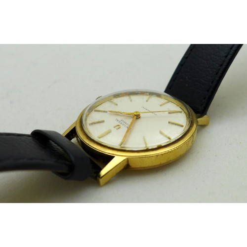 79 - A Universal Geneve Automatic 9ct gold cased gentleman's wristwatch, circa 1970s, the circular silver... 