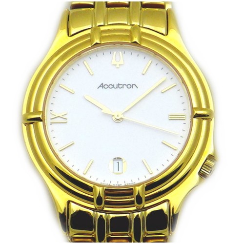 74 - A modern Bulova Accutron gentleman's gold plated wristwatch, the circular white dial with gold baton... 