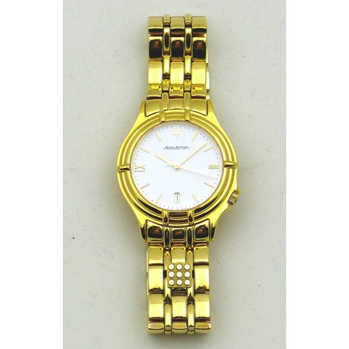 74 - A modern Bulova Accutron gentleman's gold plated wristwatch, the circular white dial with gold baton... 