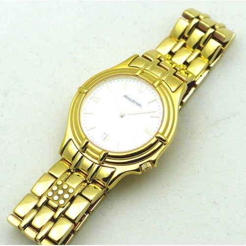 74 - A modern Bulova Accutron gentleman's gold plated wristwatch, the circular white dial with gold baton... 