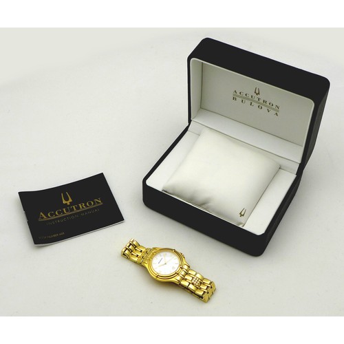 74 - A modern Bulova Accutron gentleman's gold plated wristwatch, the circular white dial with gold baton... 