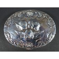 An Edwardian silver box, of oval section with hinged cover, repousse decorated with a 'Reynolds Ange... 