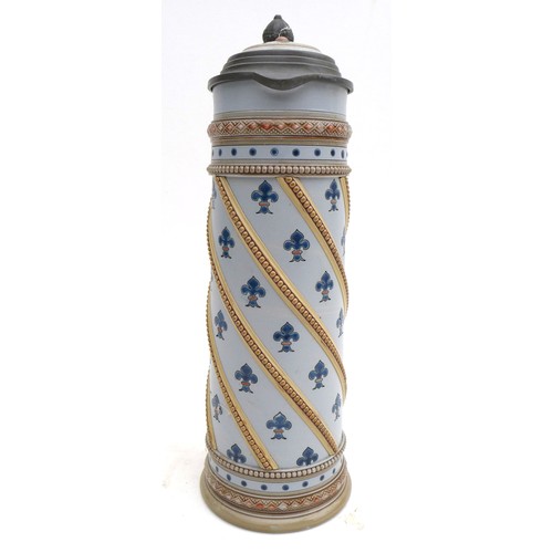 23 - A German 'Mettlach' pottery beer stein, decorated with fleur-de-lis on a pale blue ground, with meta... 