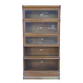 A Globe Wernicke bookcase, mid 20th century, in five graduating sections with fold away glazed doors... 