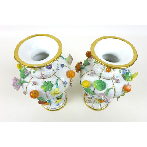 15 - A pair of late 19th century Meissen porcelain vases, encrusted with flowers and fruit, a/f one smash... 