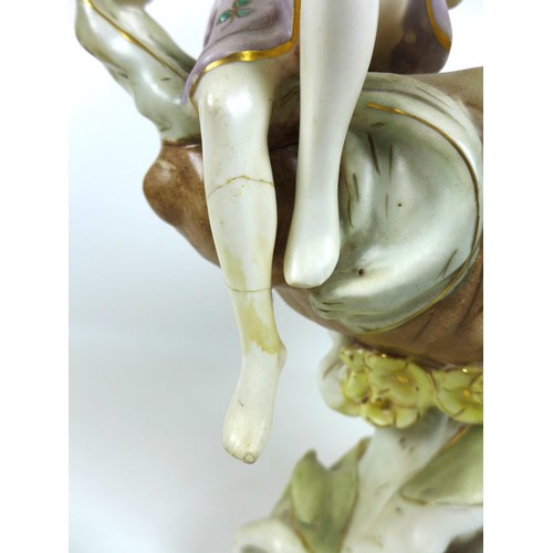 47 - A Dux ceramic centrepiece, formed as a conch shell with two classical ladies draped beside it, a/f d... 