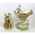 A Dux ceramic centrepiece, formed as a conch shell with two classical ladies draped beside it, a/f d... 
