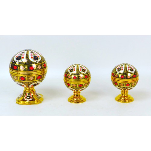 58 - Three Royal Crown Derby paperweights, comprising a 'Millenium Globe Clock', 'Millenium Globe Baromet... 