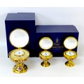 Three Royal Crown Derby paperweights, comprising a 'Millenium Globe Clock', 'Millenium Globe Baromet... 