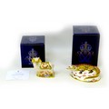 Two Royal Crown Derby paperweights, one modelled as a crocodile, 6cm high, and a visitor centre excl... 