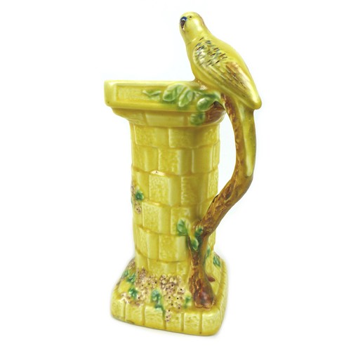7 - A vintage ceramic jug, by Waddenheath, circa 1960, modelled as a budgerigar perched on a column with... 