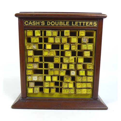 105 - An Edwardian mahogany table top cabinet, advertising interest, for 'Cash's Double Letters', containi... 