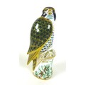A Royal Crown Derby paperweight, modelled as a Harrods Peregrine Falcon, limited edition 158/250, wi... 