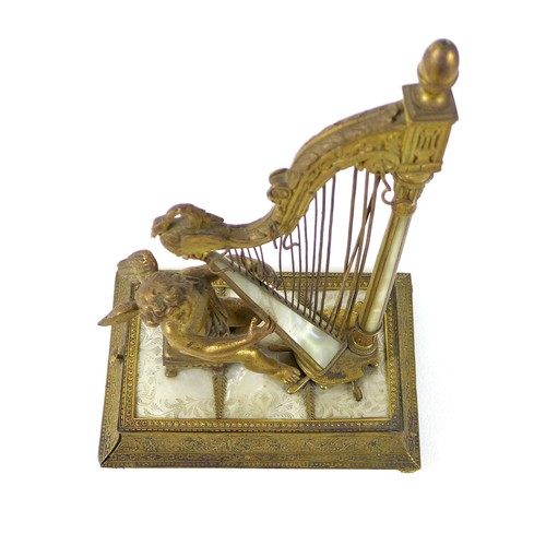 106 - A French Palais Royale ormolu jewel stand incorporating a music box, early 19th century, in the form... 