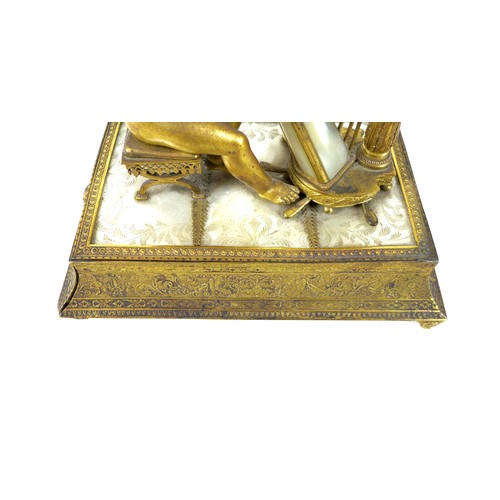 106 - A French Palais Royale ormolu jewel stand incorporating a music box, early 19th century, in the form... 