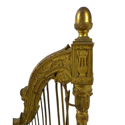 106 - A French Palais Royale ormolu jewel stand incorporating a music box, early 19th century, in the form... 