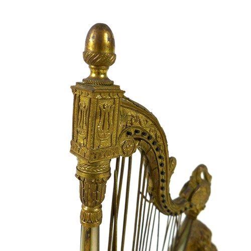 106 - A French Palais Royale ormolu jewel stand incorporating a music box, early 19th century, in the form... 