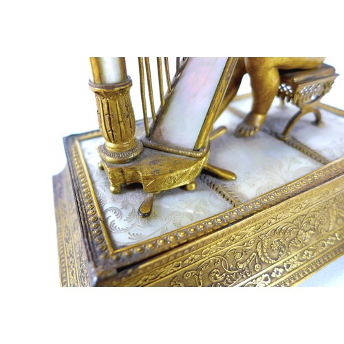 106 - A French Palais Royale ormolu jewel stand incorporating a music box, early 19th century, in the form... 