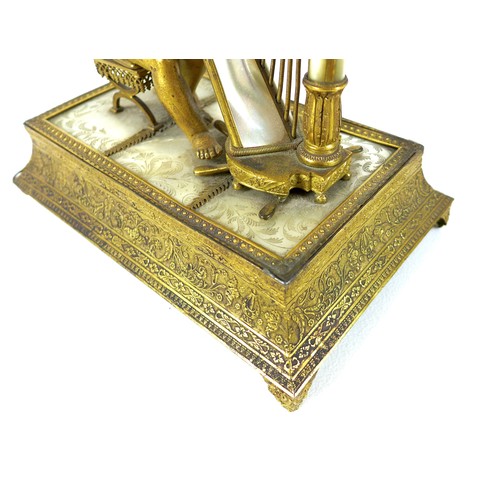 106 - A French Palais Royale ormolu jewel stand incorporating a music box, early 19th century, in the form... 