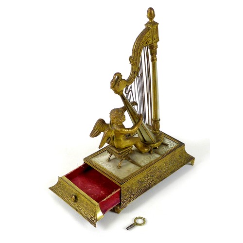 106 - A French Palais Royale ormolu jewel stand incorporating a music box, early 19th century, in the form... 