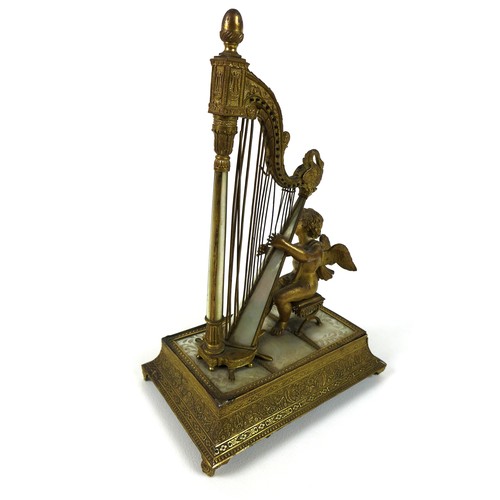 106 - A French Palais Royale ormolu jewel stand incorporating a music box, early 19th century, in the form... 