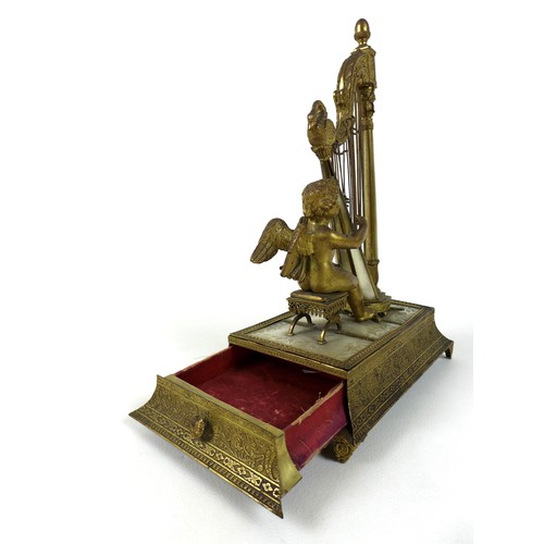 106 - A French Palais Royale ormolu jewel stand incorporating a music box, early 19th century, in the form... 