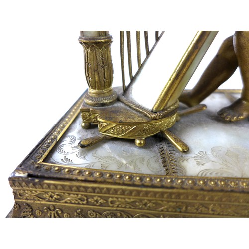 106 - A French Palais Royale ormolu jewel stand incorporating a music box, early 19th century, in the form... 