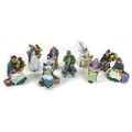 A group of nine Royal Doulton figurines, comprising 'The Old Balloon Seller', HN1315, 18cm high, 'Th... 