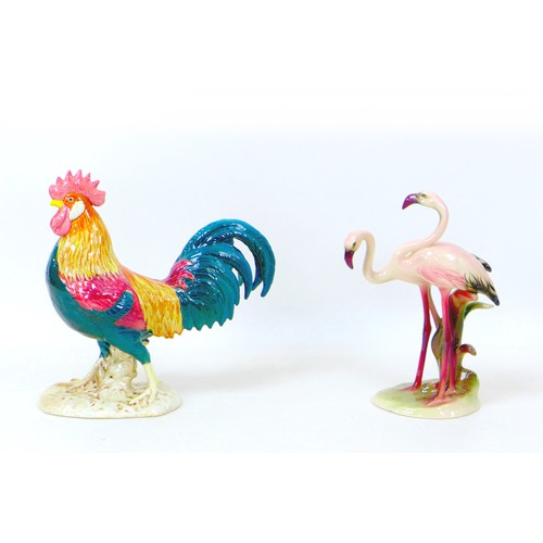 40 - Two early to mid 20th century ceramic bird figurines, Comprising an Art Deco Keramos figural group o... 