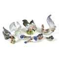 A group of nine ceramic figurines, all modelled as birds, comprising a Beswick 'Jay', model 1219, im... 